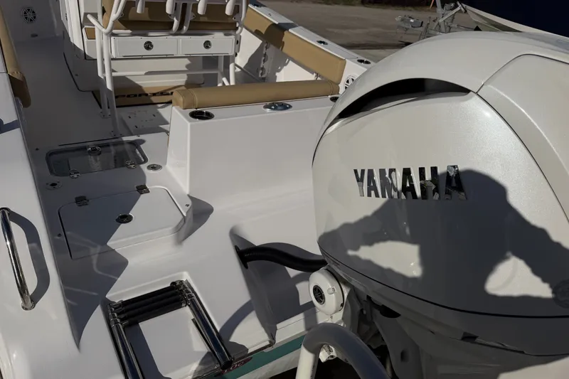 Slide: The Image of 2025 Sportsman Heritage 231 Center Console boat with Yamaha engine, interior view. - 13