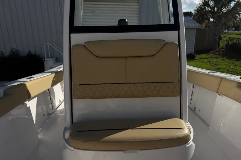Slide: The Image of 2025 Sportsman Heritage 231 Center Console boat with tan seating and sleek design. - 26