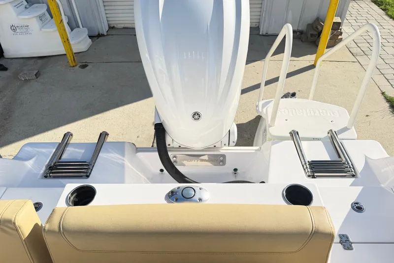 Slide: The Image of 2025 Sportsman Heritage 231 Center Console boat with dual ladders and engine view. - 35