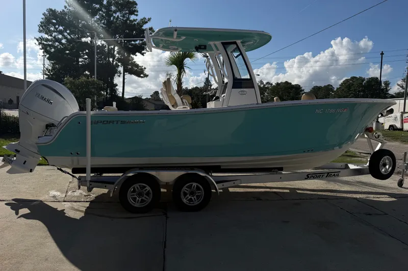 Slide: The Image of 2025 Sportsman Heritage 231 Center Console boat on trailer, featuring Yamaha engine. - 11