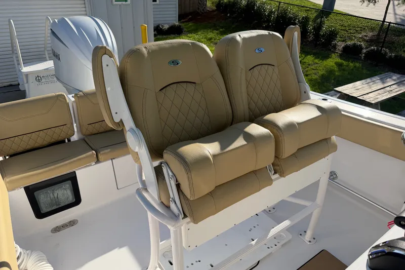 Slide: The Image of 2025 Sportsman Heritage 231 Center Console boat with tan cushioned seating. - 43