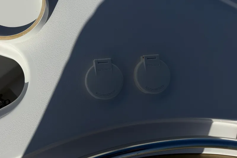 Slide: The Image of 2025 Sportsman Heritage 231 Center Console boat deck with dual covered outlets. - 20