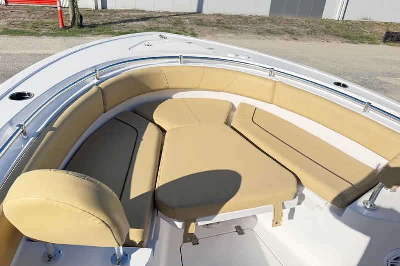 Slide: The Image of 2025 Sportsman Heritage 231 Center Console boat with tan cushioned seating area. - 36