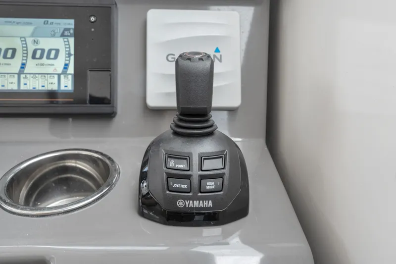 Slide: The Image of Yamaha joystick control on 2018 Pursuit DC 365 Dual Console boat dashboard. - 43