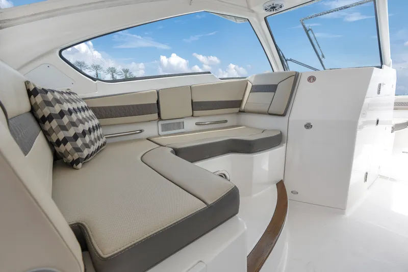 Slide: The Image of Luxurious interior of 2018 Pursuit DC 365 Dual Console boat with plush seating. - 32