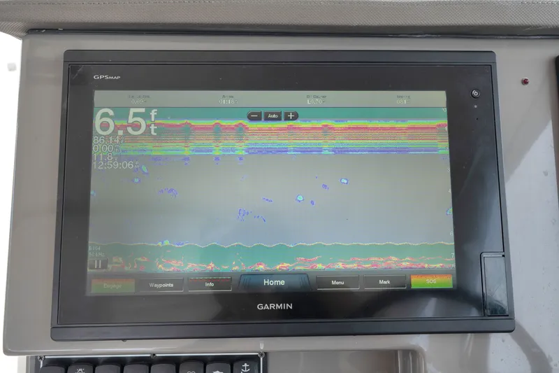 Slide: The Image of Garmin GPS display on 2018 Pursuit DC 365 Dual Console, showing depth and sonar data. - 40