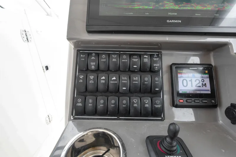 Slide: The Image of Control panel of a 2018 Pursuit DC 365 Dual Console boat with Garmin display. - 46