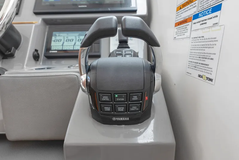 Slide: The Image of Yamaha throttle control on 2018 Pursuit DC 365 Dual Console boat dashboard. - 44