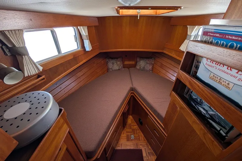 Slide: The Image of 1987 Island Gypsy 32 boat cabin with cozy V-berth and wooden interior. - 12