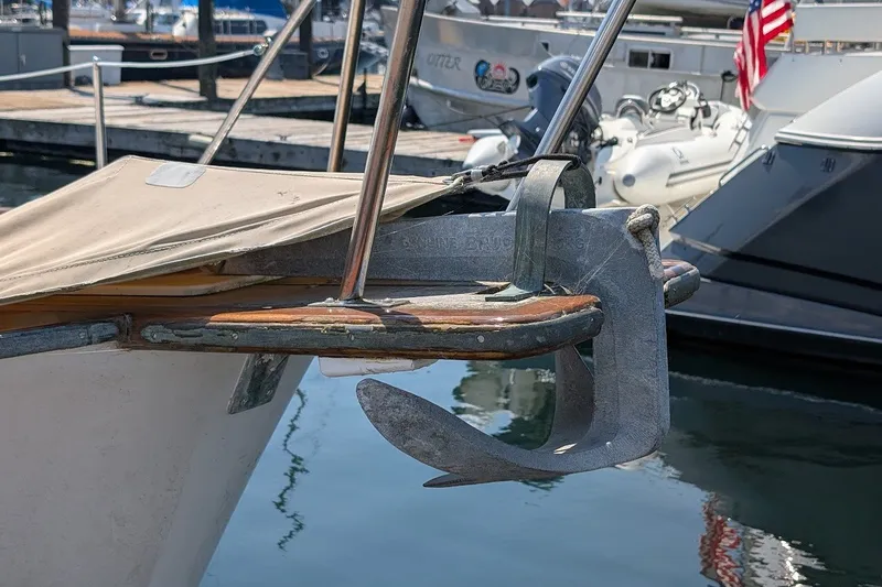 Slide: The Image of 1987 Island Gypsy 32 boat anchor detail at marina dock. - 32