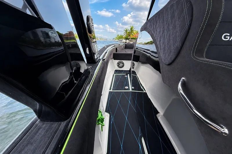 Slide: The Image of Interior view of a 2017 Statement 380 Open boat, featuring sleek design and luxurious seating. - 28