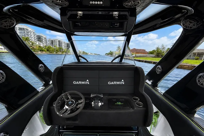 Slide: The Image of Cockpit view of 2017 Statement 380 Open boat with Garmin navigation system. - 23
