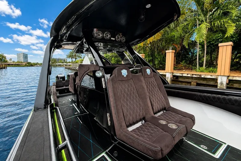 Slide: The Image of Luxurious 2017 Statement 380 Open boat interior with plush seating and scenic waterfront view. - 34