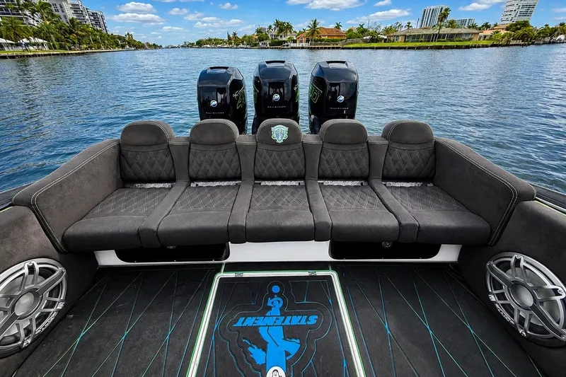 Slide: The Image of Luxury seating on 2017 Statement 380 Open boat with scenic water view. - 18