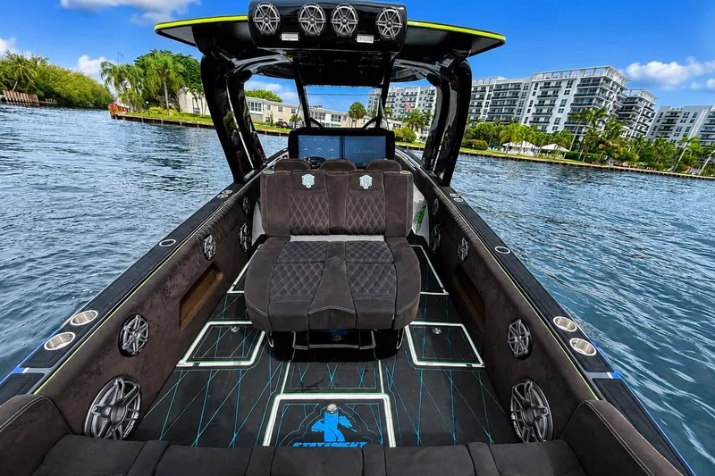 Slide: The Image of Luxurious 2017 Statement 380 Open boat interior with plush seating and waterfront view. - 21