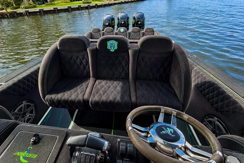 Slide: The Image of Luxurious interior of 2017 Statement 380 Open boat with plush seating and sleek steering wheel. - 22