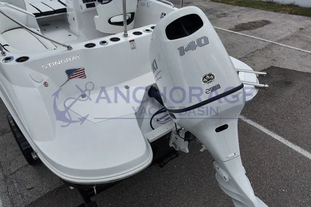 Slide: The Image of Stingray 20 SC from 2027 with a 140 HP outboard motor, parked on a lot. - 14