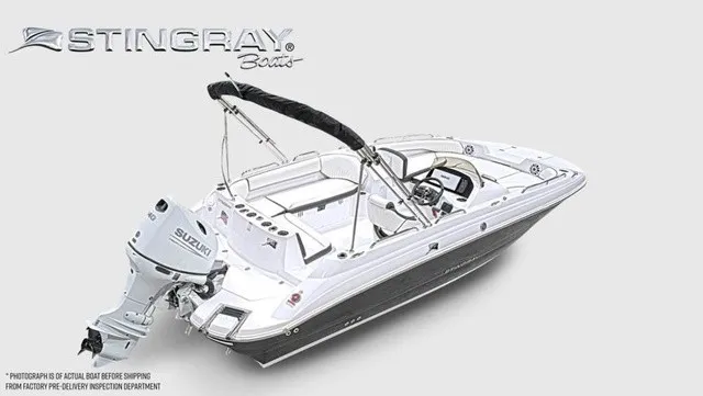 Slide: The Image of Stingray 20 SC boat from 2027 with Suzuki outboard motor, white hull, and black sunshade. - 20