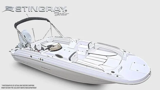 Slide: The Image of The image shows a modern Stingray 22 SC boat with sleek white seating and a Bimini top. - 13