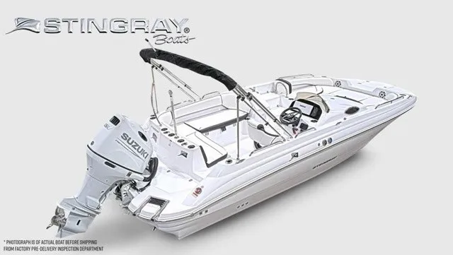 Slide: The Image of Stingray 22 SC 2027: Sleek white boat with Suzuki outboard motor, spacious deck, and black bimini top. - 14