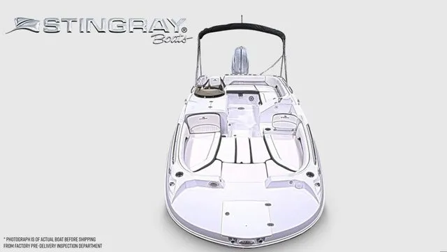 Slide: The Image of The image shows a modern Stingray 22 SC boat with a sleek white design and a Bimini top. - 9