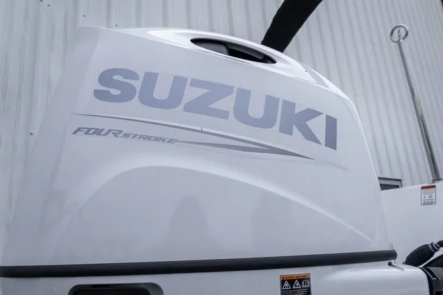 Slide: The Image of Close-up of a Suzuki four-stroke outboard motor on a boat. - 17
