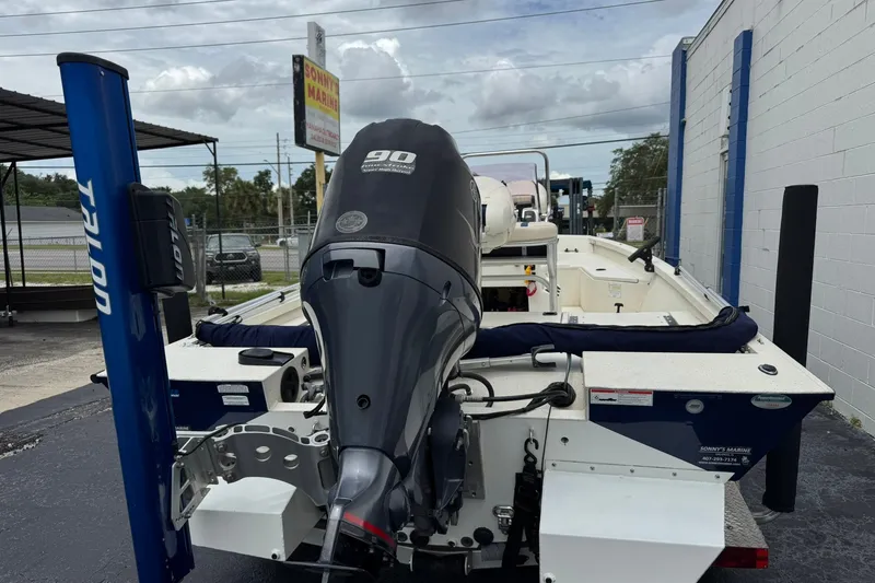 Slide: The Image of 2018 G3 Bay 18 DLX boat with 90 HP motor, parked outdoors. - 5