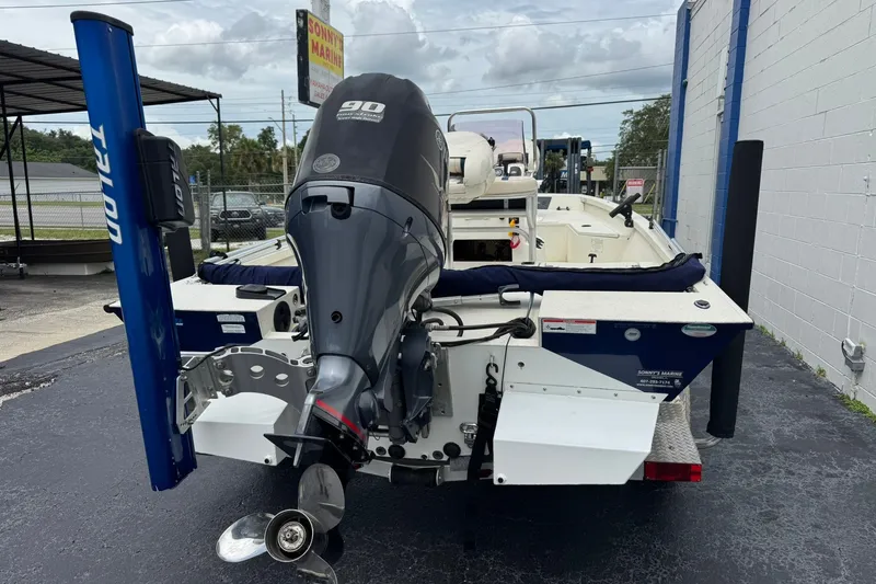 Slide: The Image of 2018 G3 Bay 18 DLX boat with Yamaha 90 outboard motor, parked at a marina. - 6