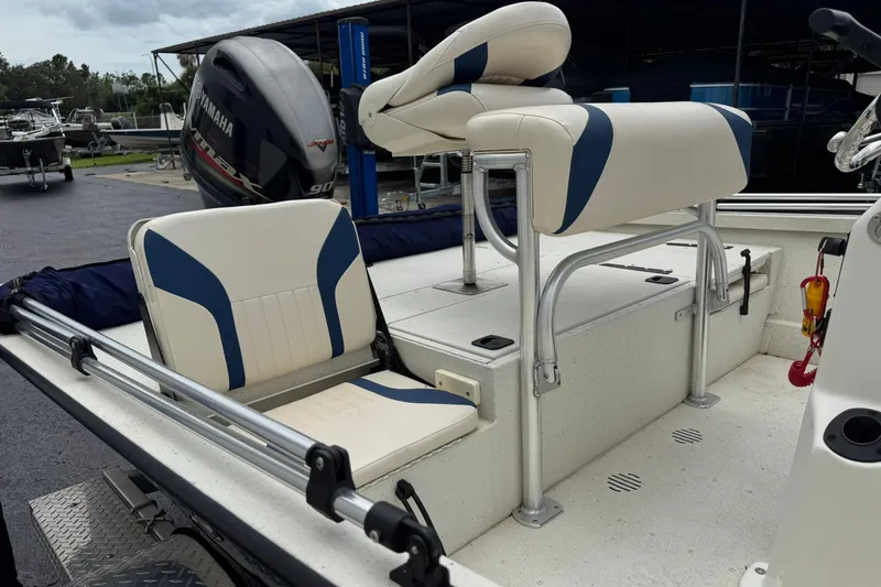 Slide: The Image of 2018 G3 Bay 18 DLX boat interior with Yamaha 90 engine, featuring cushioned seating. - 8