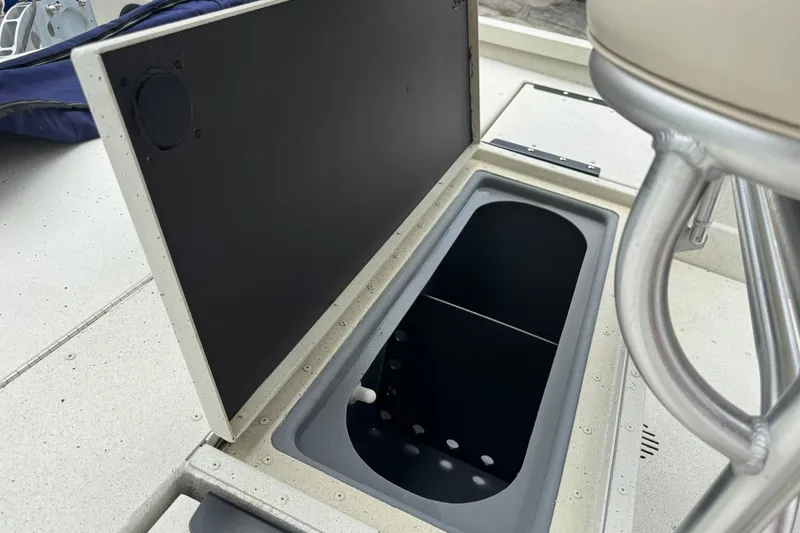 Slide: The Image of Open storage compartment on 2018 G3 Bay 18 DLX boat deck. - 16