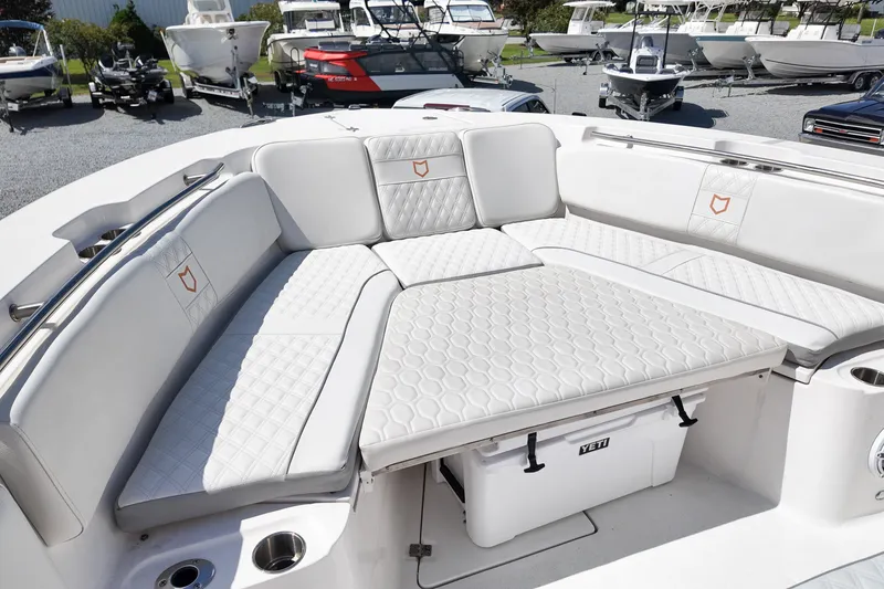 Slide: The Image of Luxurious seating area on 2025 Sea Fox 328 Commander boat, featuring white cushioned upholstery. - 19