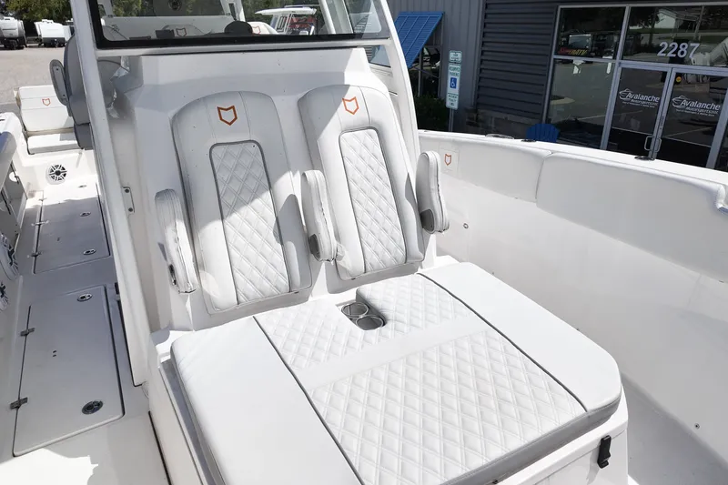 Slide: The Image of 2025 Sea Fox 328 Commander boat interior with luxurious white seating and modern design. - 20