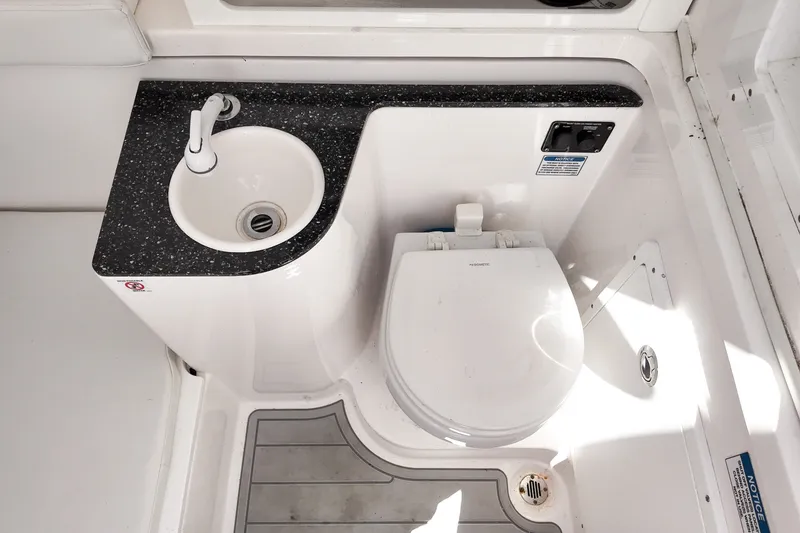 Slide: The Image of 2025 Sea Fox 328 Commander boat bathroom with sink and toilet. - 23