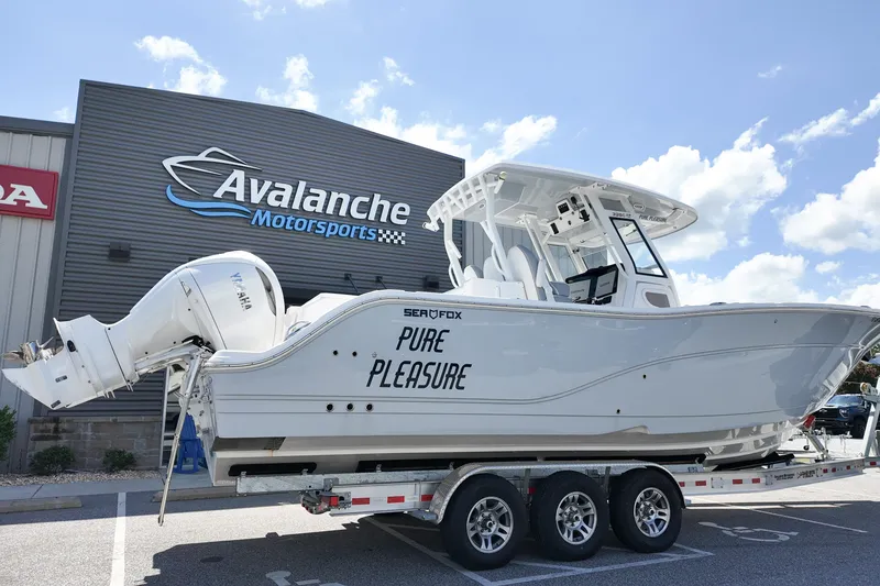 The Image of 2025 Sea Fox 328 Commander boat on trailer at Avalanche Motorsports dealership. - 1