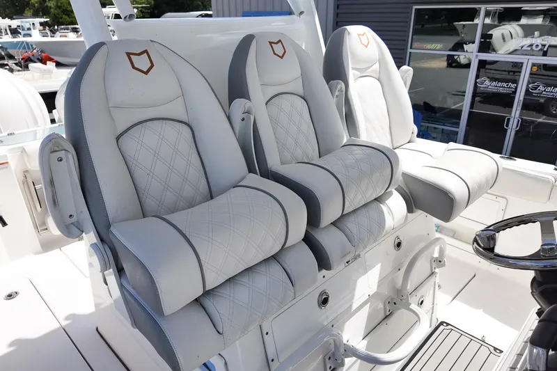 Slide: The Image of Luxury seating on 2025 Sea Fox 328 Commander boat, featuring elegant white upholstery. - 13