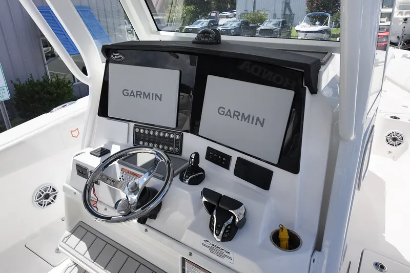 Slide: The Image of 2025 Sea Fox 328 Commander helm with dual Garmin displays and modern controls. - 15