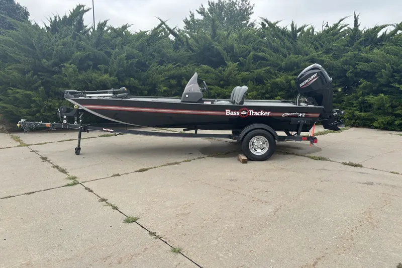 The Image of 2021 Tracker Bass Tracker Classic XL boat on trailer, parked outdoors. - 0