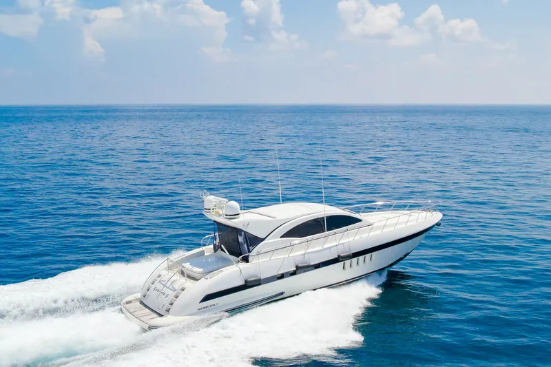 Slide: The Image of 2007 Mangusta 72 Motor Yacht cruising on open sea under clear skies. - 5