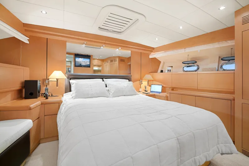 Slide: The Image of Luxurious bedroom interior of 2007 Mangusta 72 Motor Yacht with elegant wood finishes. - 38