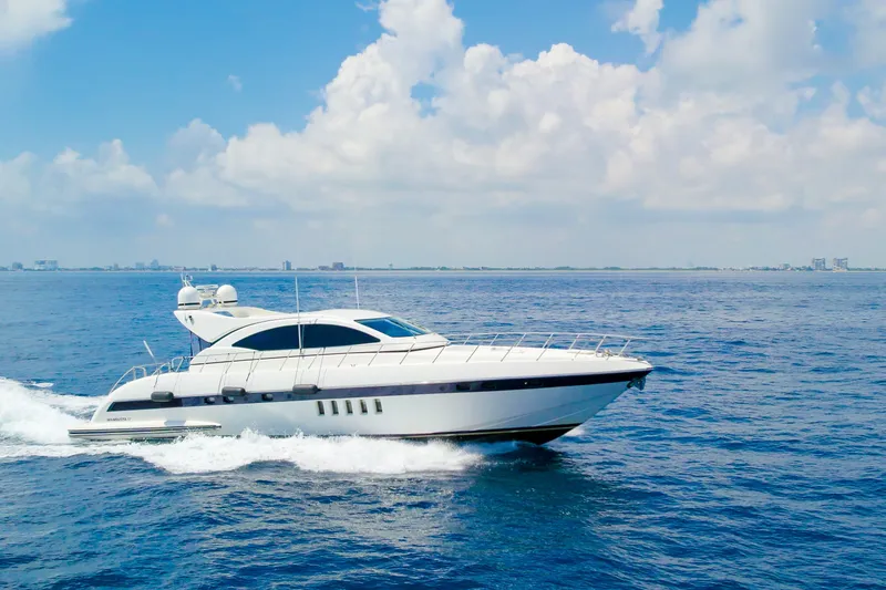 Slide: The Image of 2007 Mangusta 72 Motor Yacht cruising on open sea under blue sky. - 3