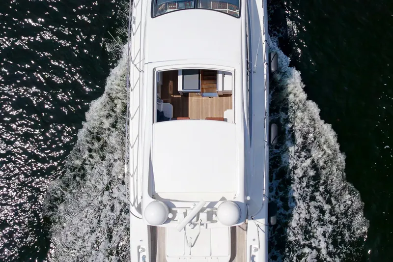 Slide: The Image of Top view of 2007 Mangusta 72 Motor Yacht cruising on water. - 12