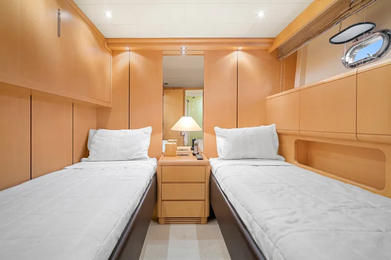 Slide: The Image of The 2007 Mangusta 72 Motor Yacht cabin features twin beds and a sleek design. - 46