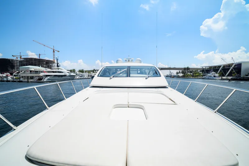 Slide: The Image of 2007 Mangusta 72 Motor Yacht on water, sunny day, marina background. - 26