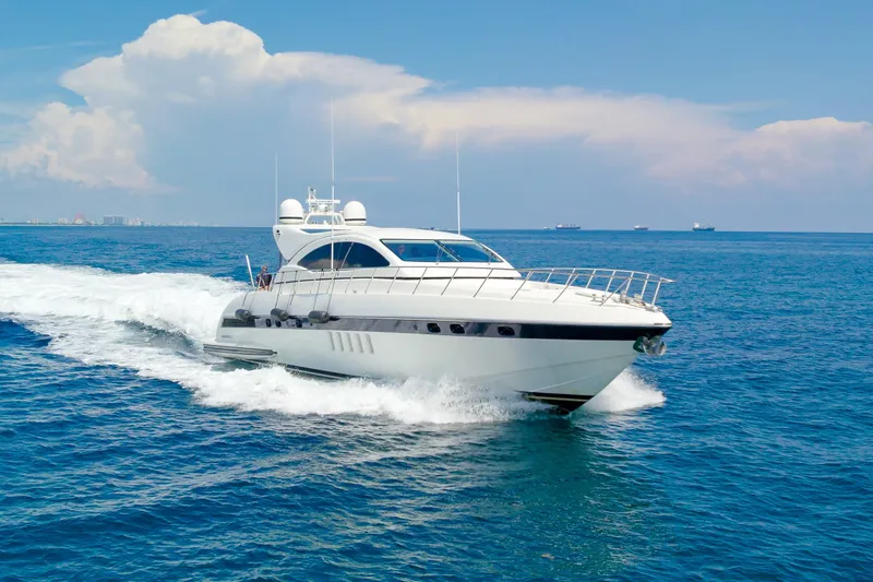 Slide: The Image of 2007 Mangusta 72 Motor Yacht cruising on open sea under clear skies. - 6