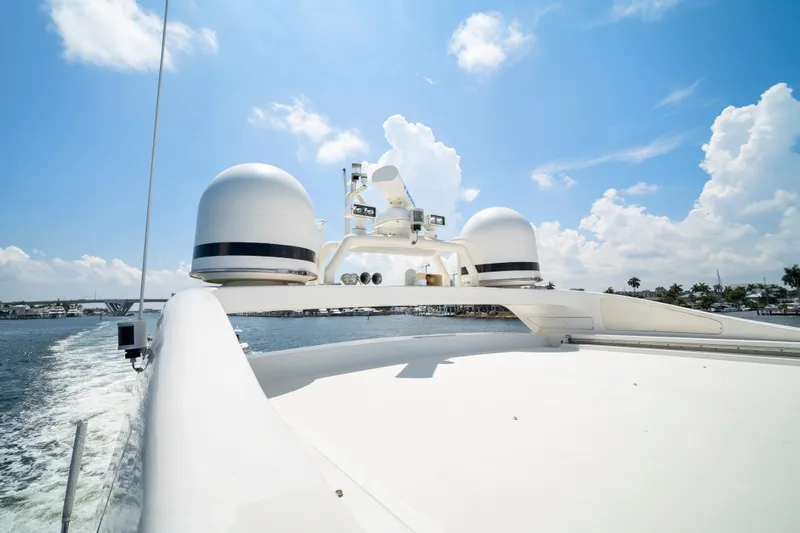 Slide: The Image of 2007 Mangusta 72 Motor Yacht cruising under a bright blue sky. - 16