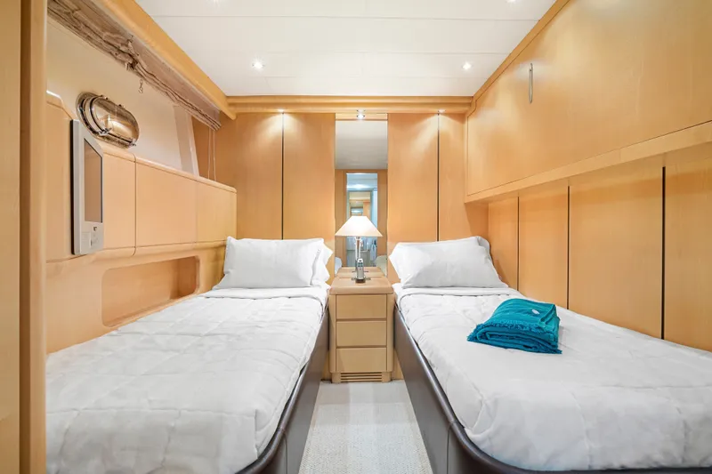 Slide: The Image of Luxurious twin cabin interior of 2007 Mangusta 72 Motor Yacht with modern wood finish. - 42