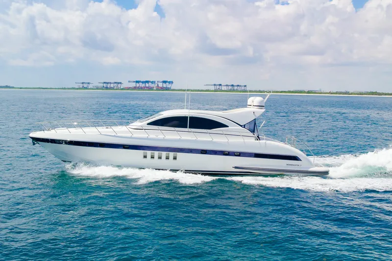 Slide: The Image of 2007 Mangusta 72 Motor Yacht cruising on open water under a partly cloudy sky. - 4