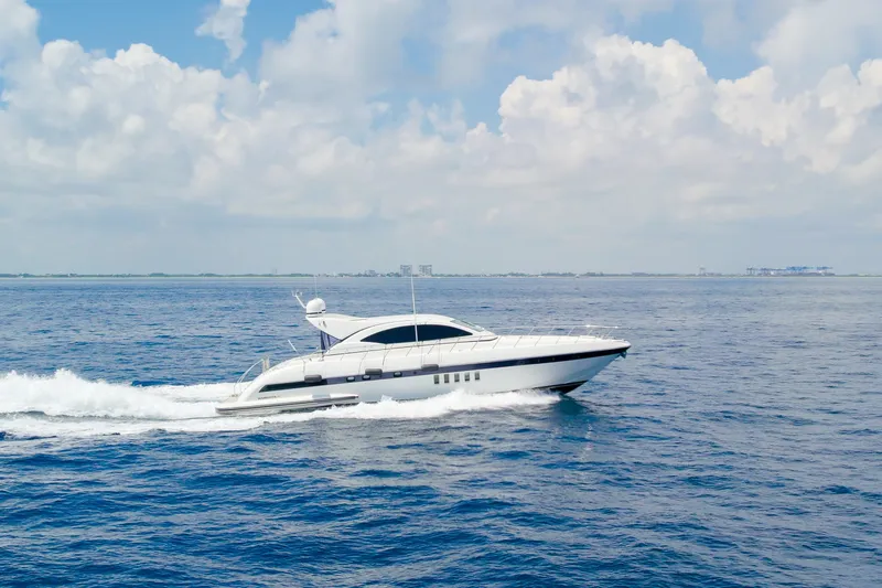 Slide: The Image of Luxurious 2007 Mangusta 72 Motor Yacht cruising on open sea under blue sky. - 8