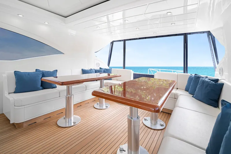 Slide: The Image of Luxurious interior of 2007 Mangusta 72 Motor Yacht with ocean view and elegant seating. - 19
