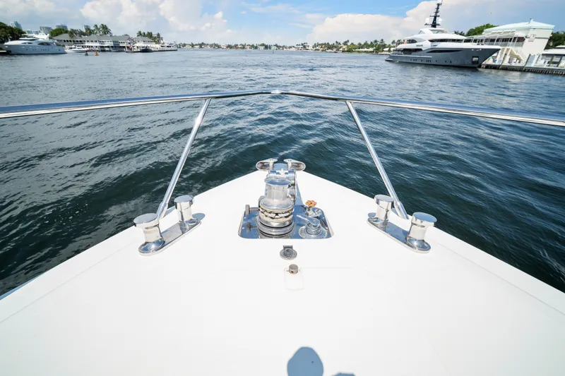 Slide: The Image of Bow view of 2007 Mangusta 72 Motor Yacht on a sunny day, docked in a marina. - 25